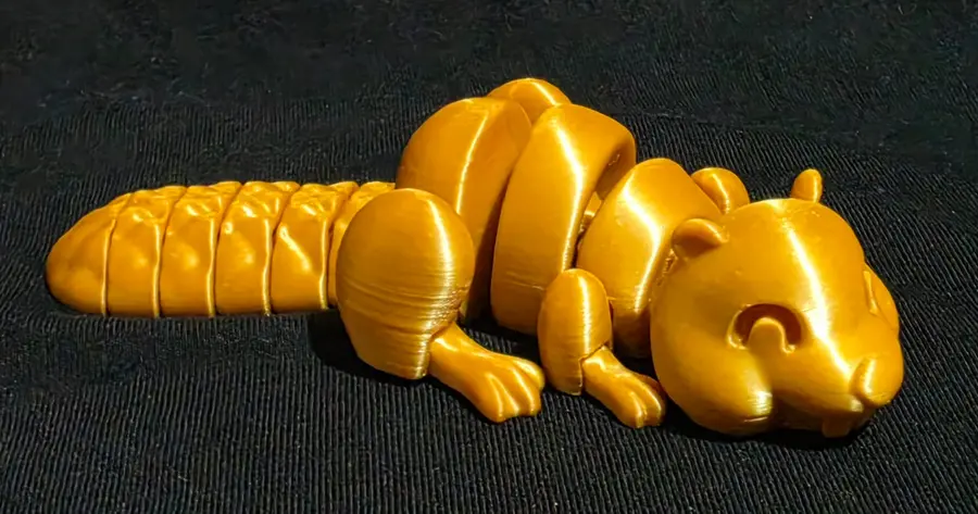 Articulated beaver, gold, side view
