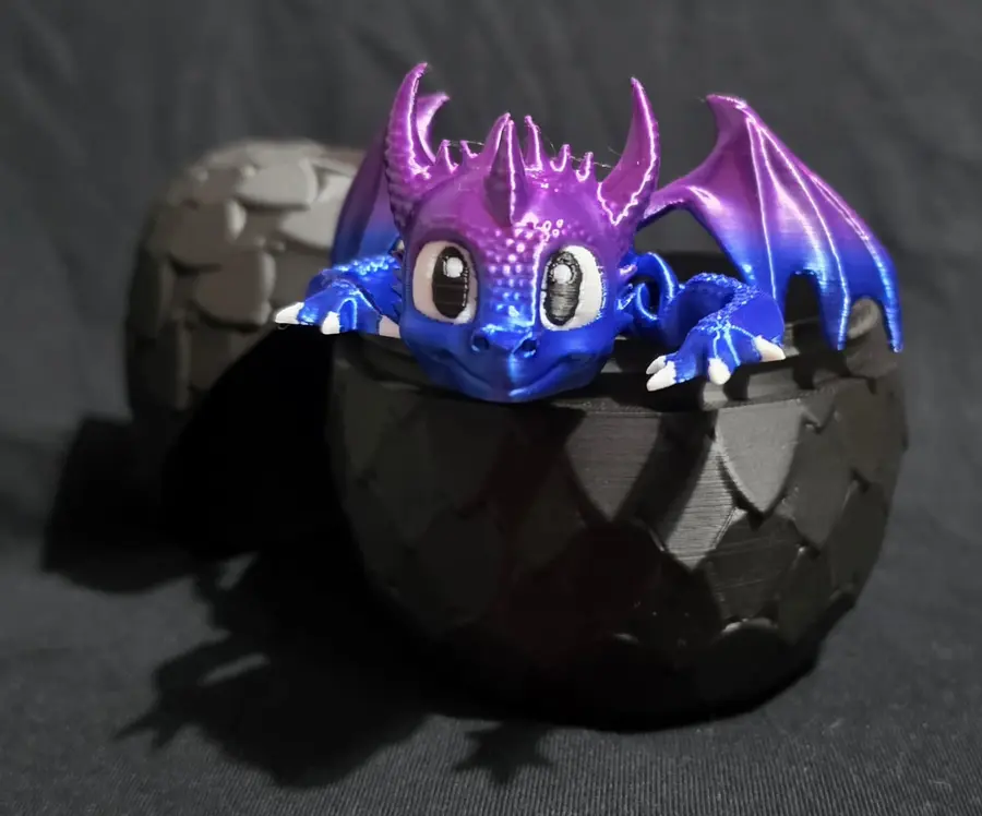 Dragon egg with dragon inside - black scale egg, purple to blue dragon