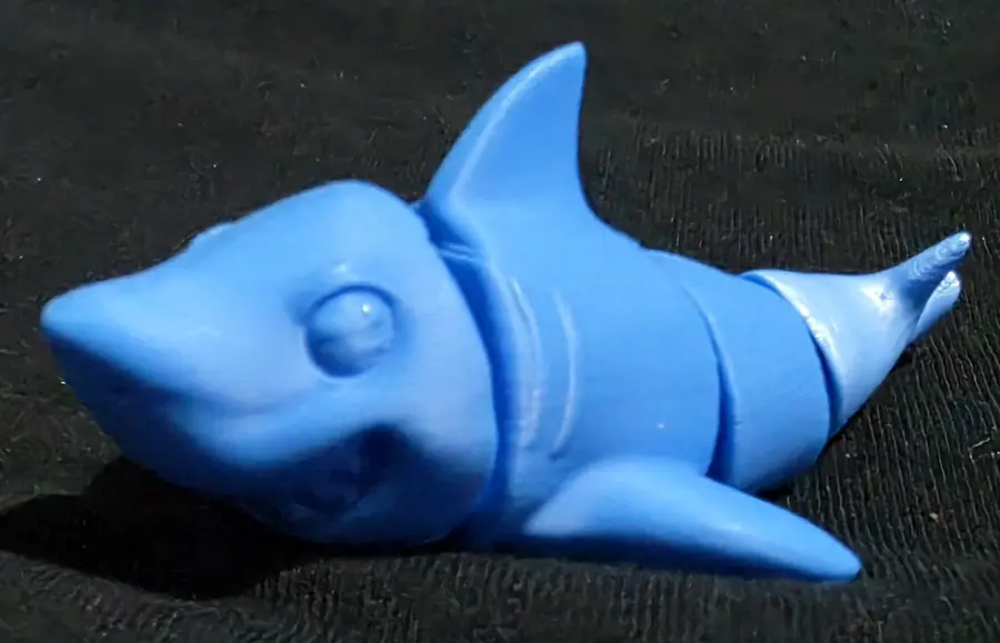 Articulated shark fidget, blue, side view