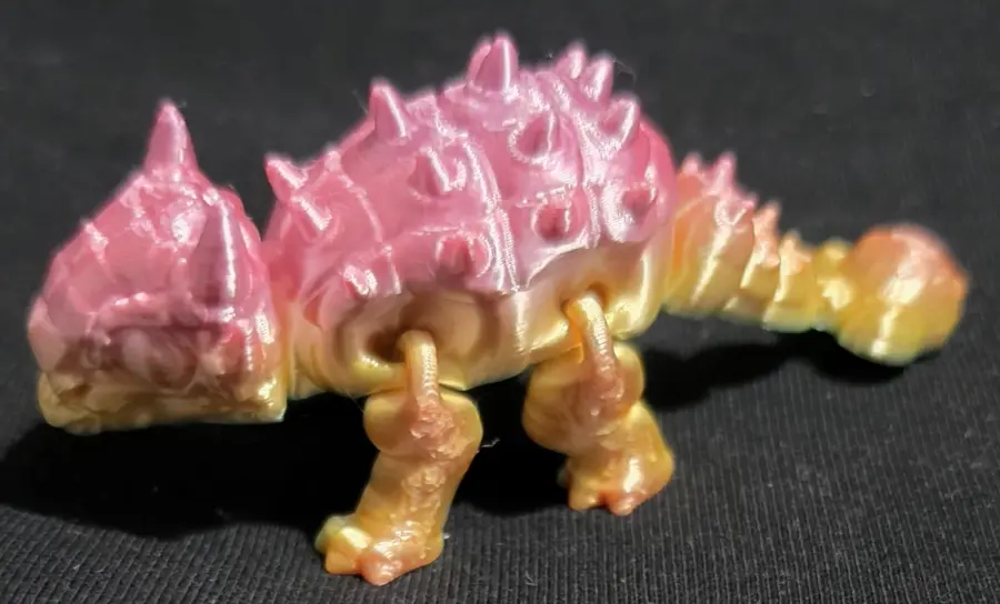 Small ankylosaurus, pink and gold